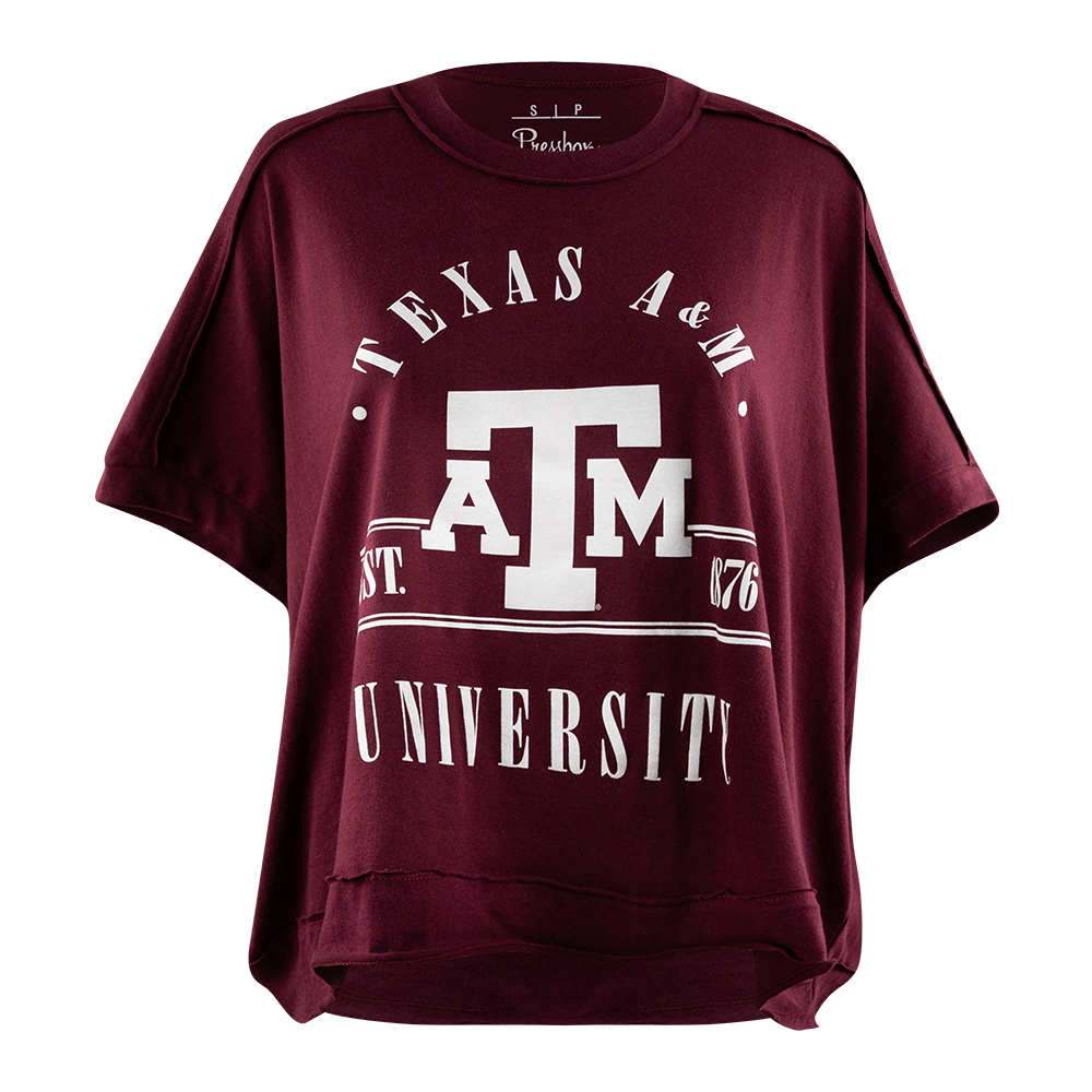 A maroon short-sleeve t-shirt with a white graphic print of the Texas A&M University 'A&M' logo and text, displayed on a clean white background.
