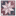 A square bandana featuring a geometric star patchwork design with various paisley and floral prints in dusty red, burgundy, navy, and white.