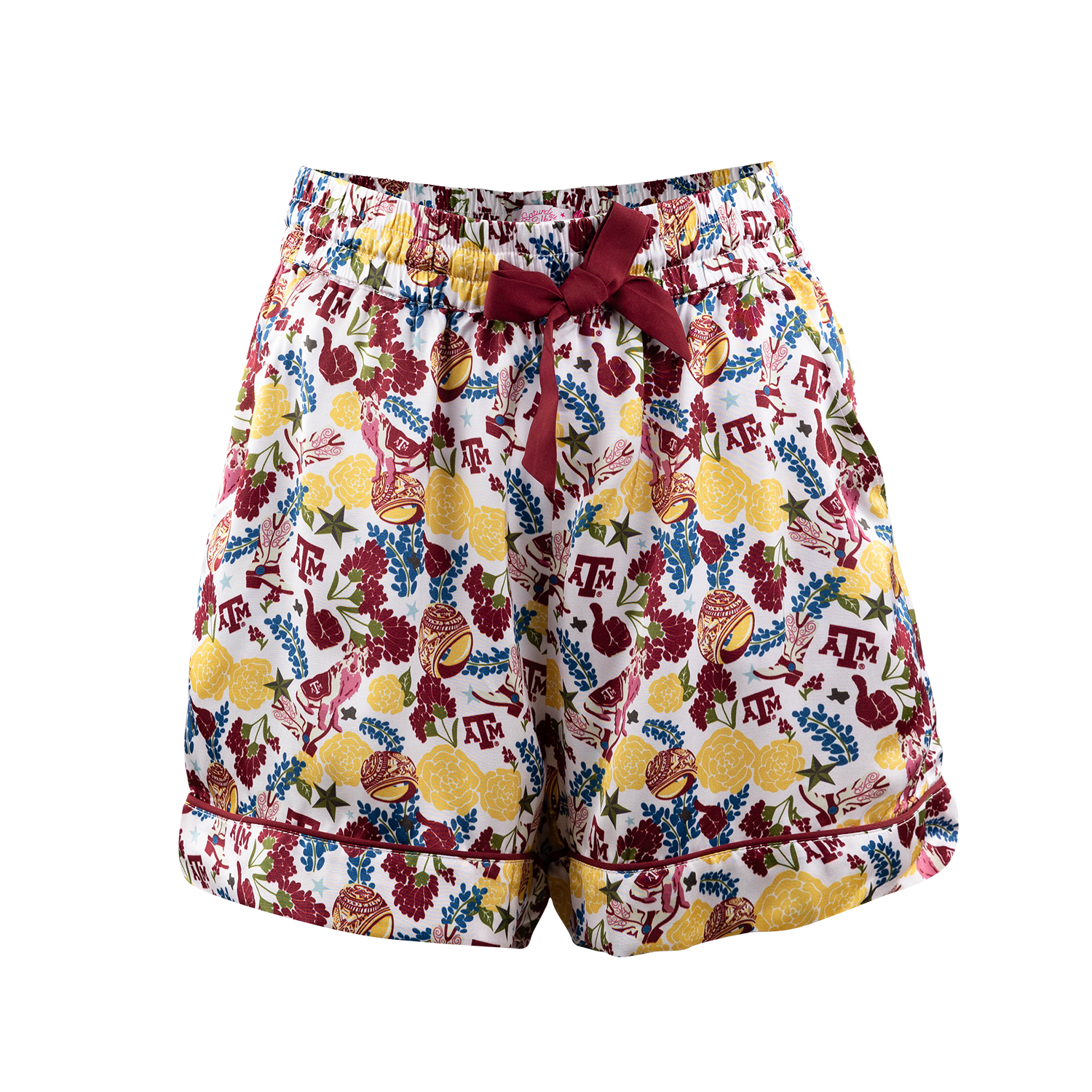 A pair of women's shorts featuring a white base with a colorful collegiate-style print of lemons, flowers, and the Texas A&M 'Texas' logo. The shorts have an elastic waistband with a dark red drawstring bow at the front center.