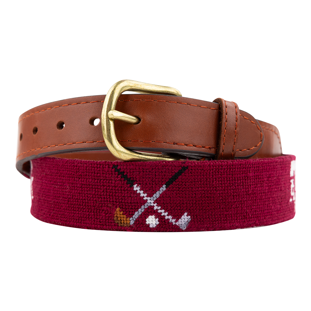 Brown leather belt with embroidered crossed golf clubs and blocked Texas A&M lettering.