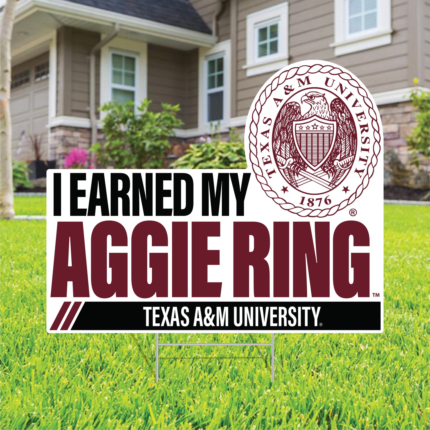 Yard sign with "I earned my Aggie Ring" in maroon and black. Texas A&M University seal next to the writing.
