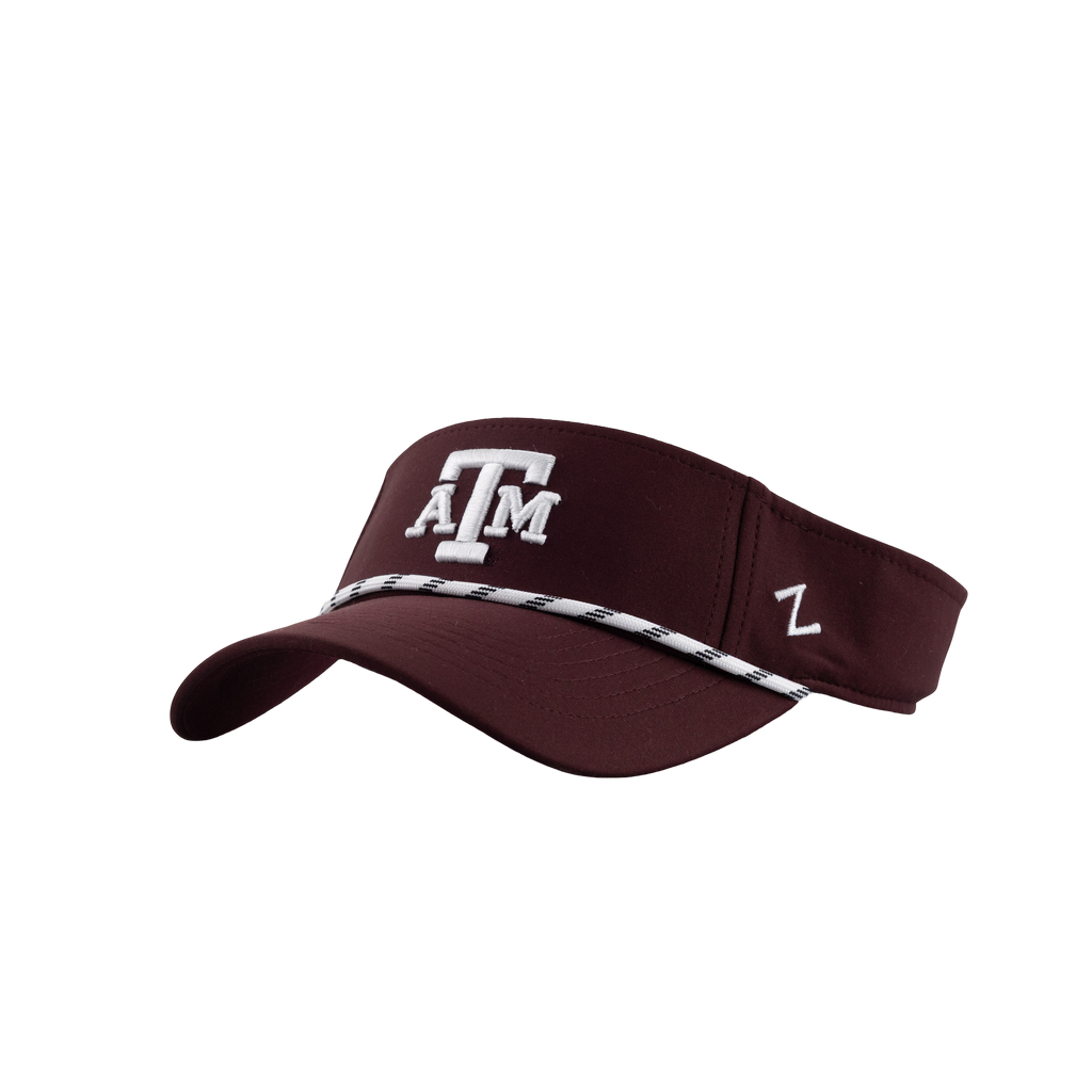 Maroon Texas A&M visor with a white embroidered ATM logo and white-and-black patterned trim along the brim.