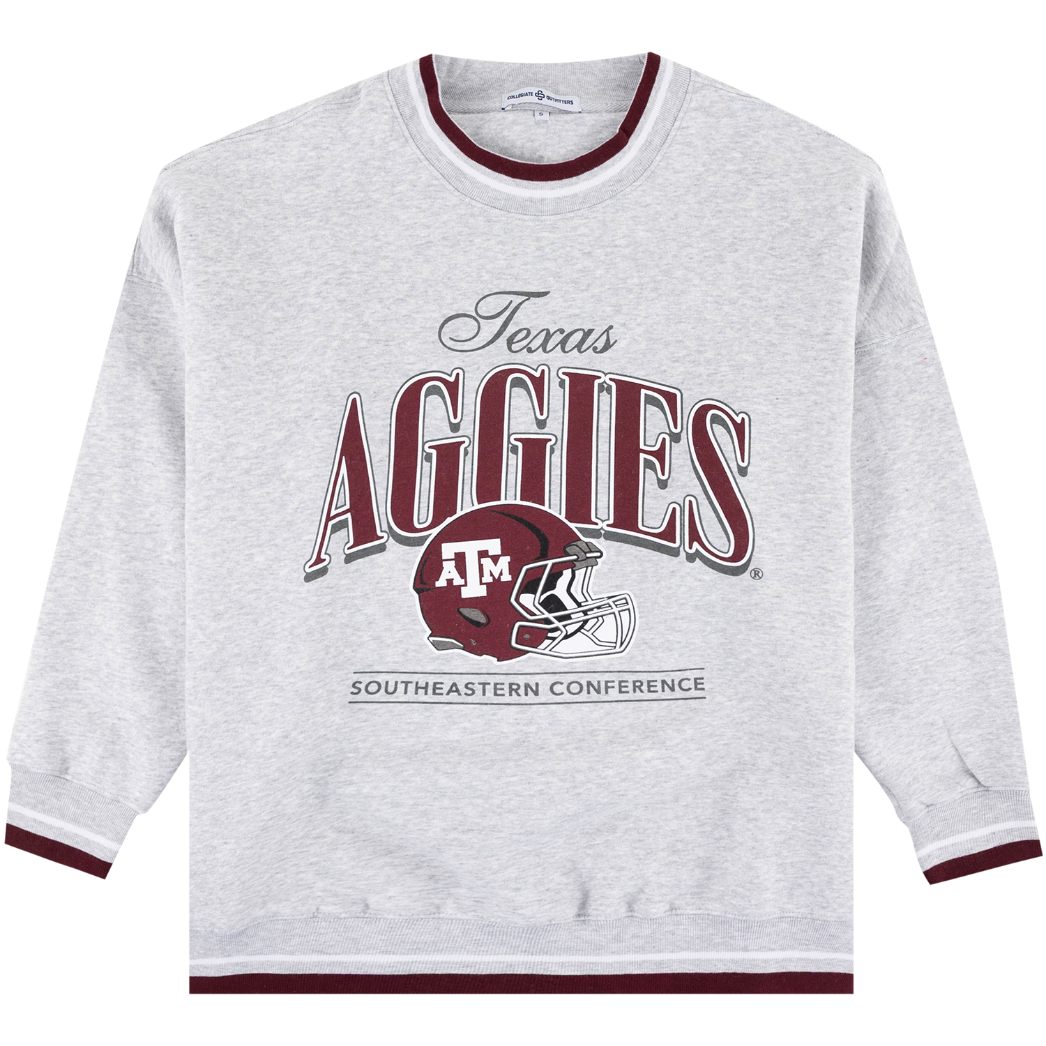A heather gray long-sleeve crewneck sweatshirt with maroon and gray graphic details on the front. The graphic features the text 'Texas AGGIES' and the Texas A&M University 'ATX' helmet logo, with 'SOUTHEASTERN CONFERENCE' printed below.