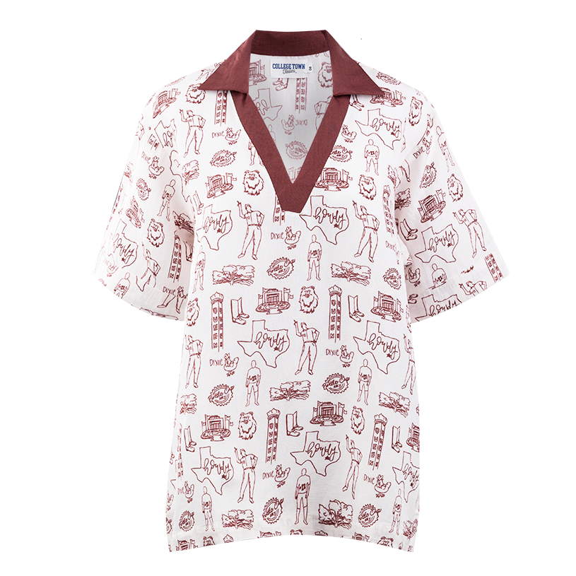 White blouse with maroon collar. Maroon outlines of Texas A&M symbols on the front.