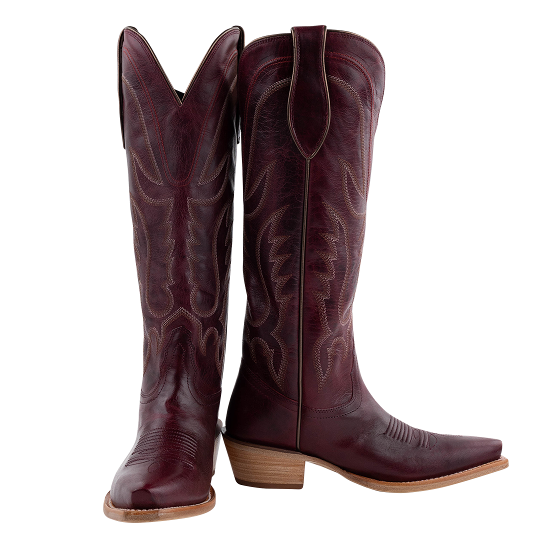 Pair of wine colored cowboy boots with intricate designs