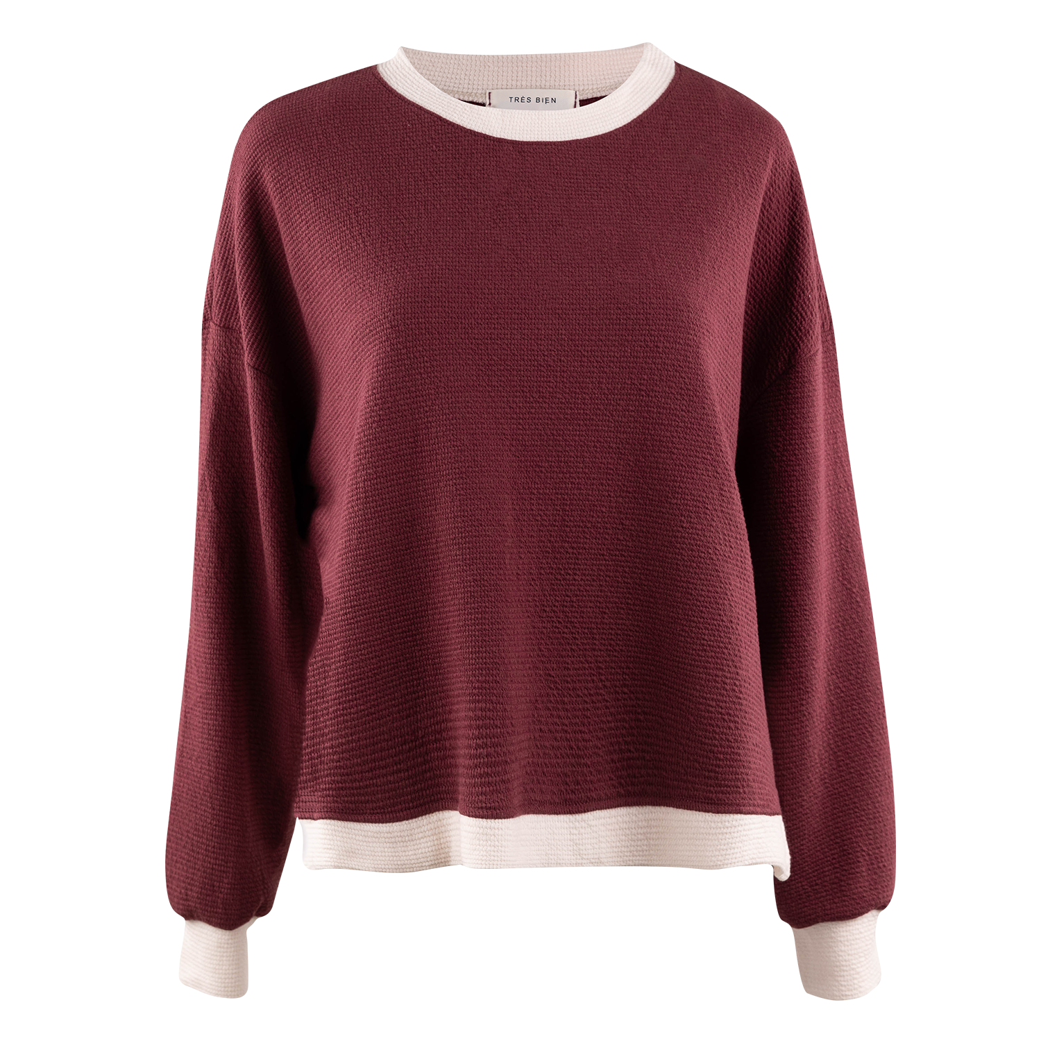 A women's long-sleeve knit sweater in burgundy with contrasting cream ribbed trim at the crew neck, hem, and cuffs, shown against a plain white background.