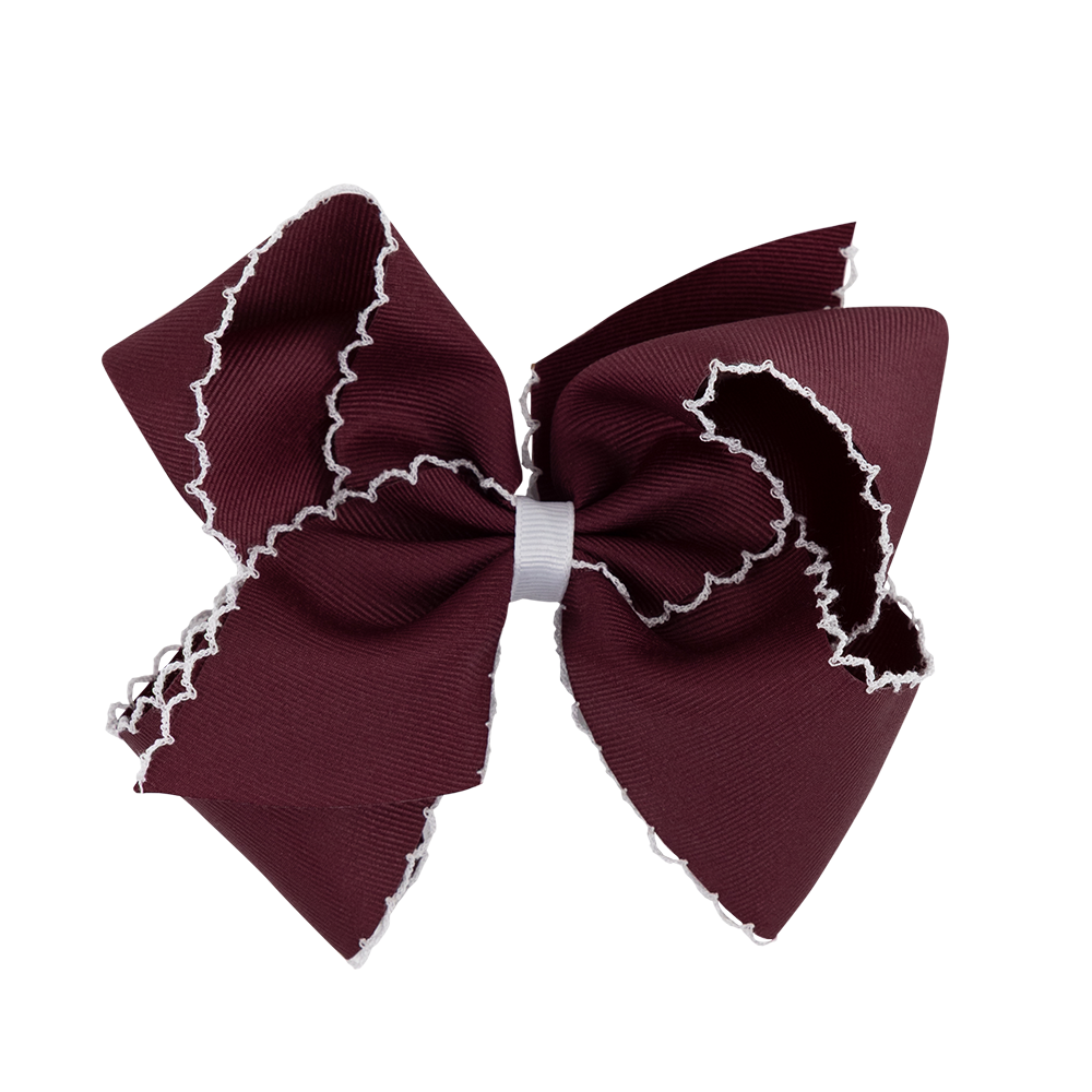 Maroon hair bow with white trim 