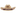 A tan straw cowboy hat embroidered with "GIG'EM AGGIES" in maroon thread on the front crown, surrounded by maroon and silver star accents. The brim features maroon and silver embroidered star and lightning-bolt designs, and the base of the crown is wrapped with a braided maroon-and-white fabric band.