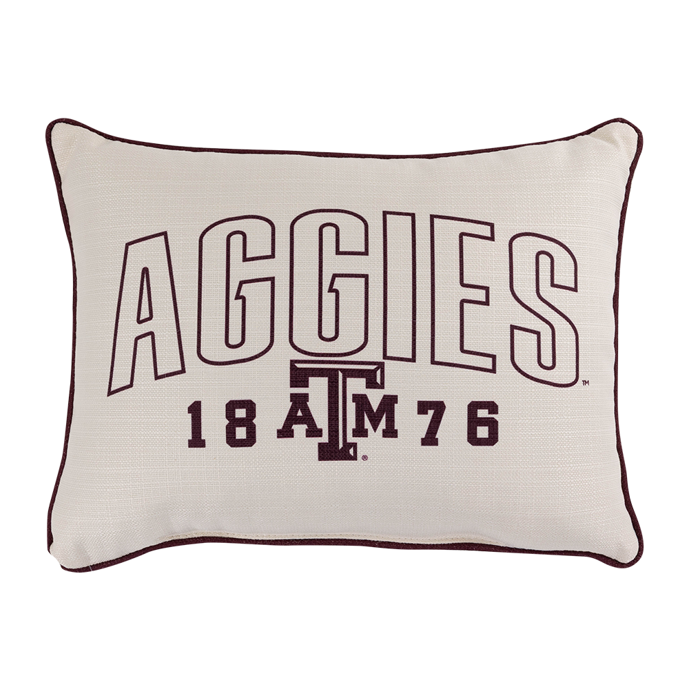 Cream colored pillow with maroon design